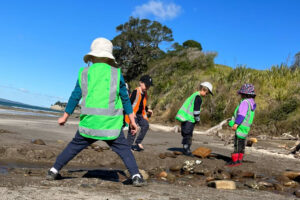 Children playing in the sand, forest school.